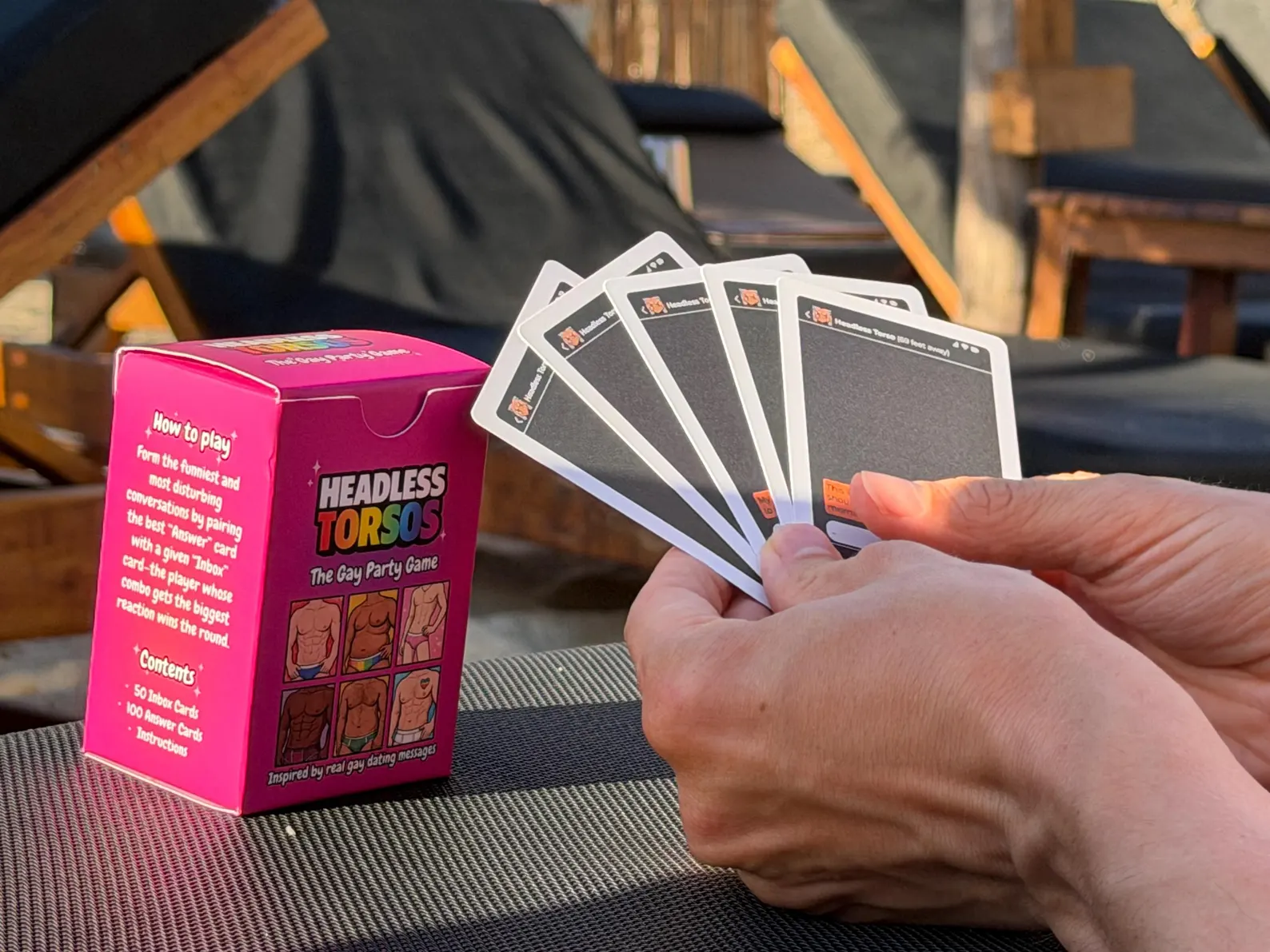 Headless Torsos box showing the how-to-play instructions next to a fanned hand of INBOX message cards
